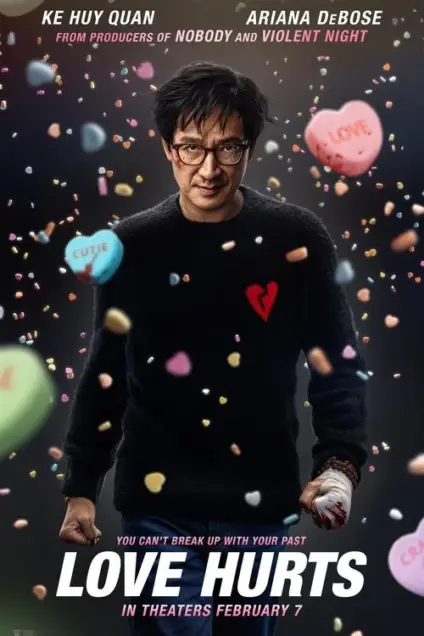 Love Hurts (2025) - Movie Poster. The movie poster features a man in the center, wearing glasses and a black sweater with a red heart on it. He has a bandaged hand and is surrounded by colorful candy hearts floating around him. The background is dark, and the text at the top of the poster reads "KE HUY QUAN" and "ARIANA DEBOSE" with the tagline "FROM PRODUCERS OF NOBODY AND VIOLENT NIGHT." Below the man, there is a tagline that says, "YOU CAN'T BREAK UP WITH YOUR PAST," and at the bottom, it states, "LOVE HURTS" with the release date "IN THEATERS FEBRUARY 7." The overall theme of the poster suggests a romantic comedy with a twist.