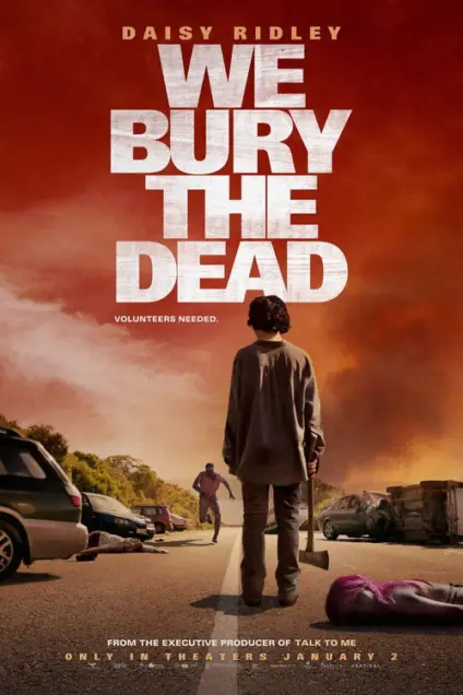 We Bury the Dead (2024) - Movie Poster. The movie poster features a dramatic and intense scene set in a desolate, post-apocalyptic landscape. The sky is a mix of dark red and orange hues, suggesting a fiery or apocalyptic atmosphere. In the foreground, a person stands in the middle of a road, holding an axe. This individual is dressed in a long, dark coat and pants, and appears to be looking towards the horizon. Behind this person, there are several vehicles, including a car that has been overturned, and a person lying on the ground, possibly deceased. The background is filled with smoke and debris, adding to the sense of chaos and destruction. At the top of the poster, the title "We Bury the Dead" is prominently displayed in large, distressed white letters. Below the title, there is a tagline that reads "Volunteers Needed." At the bottom of the poster, additional text indicates that the movie is from the executive producer of "Talk to Me" and is set to be released in theaters on January 2.