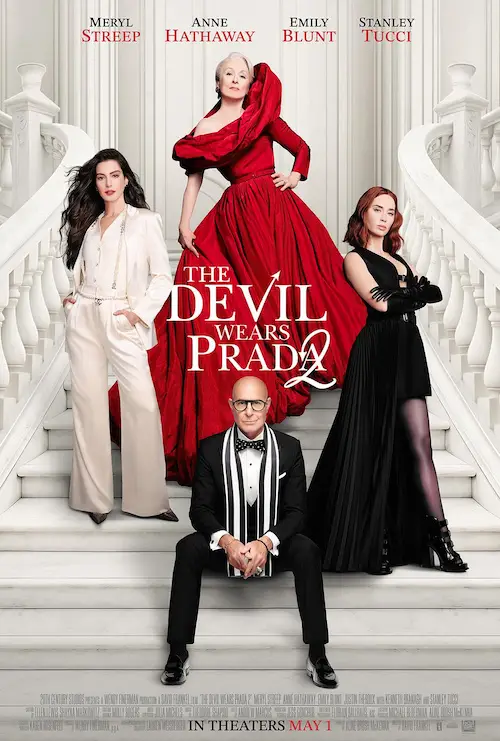 The Devil Wears Prada 2 (2026). The movie poster features four characters prominently positioned on a grand staircase with ornate railings. From left to right, the first character is wearing a white pantsuit with a long jacket, the second character is dressed in a flowing red gown, the third character is in a black dress with a high slit and gloves, and the fourth character is wearing a black suit with a bow tie. Above the characters, the title "THE DEVIL WEARS PRADA" is displayed in bold, white letters with a red arrow pointing downwards. The names of the actors are listed at the top in red text. The bottom of the poster indicates the release date as "IN THEATERS MAY 1" and includes additional text and logos.