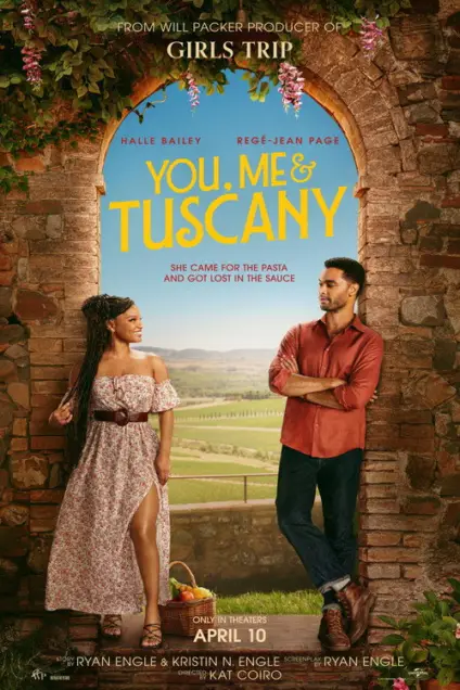 You, Me & Tuscany (2026) - Movie Poster. The movie poster features a rustic stone archway with lush greenery and pink flowers hanging from the top. Inside the archway, there is a scenic view of a picturesque landscape with rolling hills and a clear blue sky. Two characters are prominently displayed: a woman on the left wearing a floral off-shoulder dress and a man on the right in a red shirt and jeans. The woman is holding a basket filled with fresh produce, suggesting a connection to nature or a rural setting. The title "YOU, ME & TUSCANY" is displayed in large, bold letters at the top of the archway. Below the title, there is a tagline that reads, "She came for the pasta and got lost in the sauce." The poster also includes the release date, "APRIL 10," and credits for the producers, writers, and director. The overall aesthetic of the poster conveys a romantic and adventurous theme set in Tuscany.