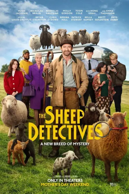 The Sheep Detectives (2026) - Movie Poster. The movie poster features a group of people standing in a field with a flock of sheep. The main characters are dressed in various outfits, including a man in a brown coat and hat holding a walking stick, a woman in a purple coat, and a young man in a brown jacket. The title "The Sheep Detectives" is prominently displayed in bold yellow letters, with a subtitle "A New Breed of Mystery" underneath. The tagline "Only in Theaters Mother's Day Weekend" is also visible. The background shows a clear blue sky and a green field, with the sheep scattered around the group.